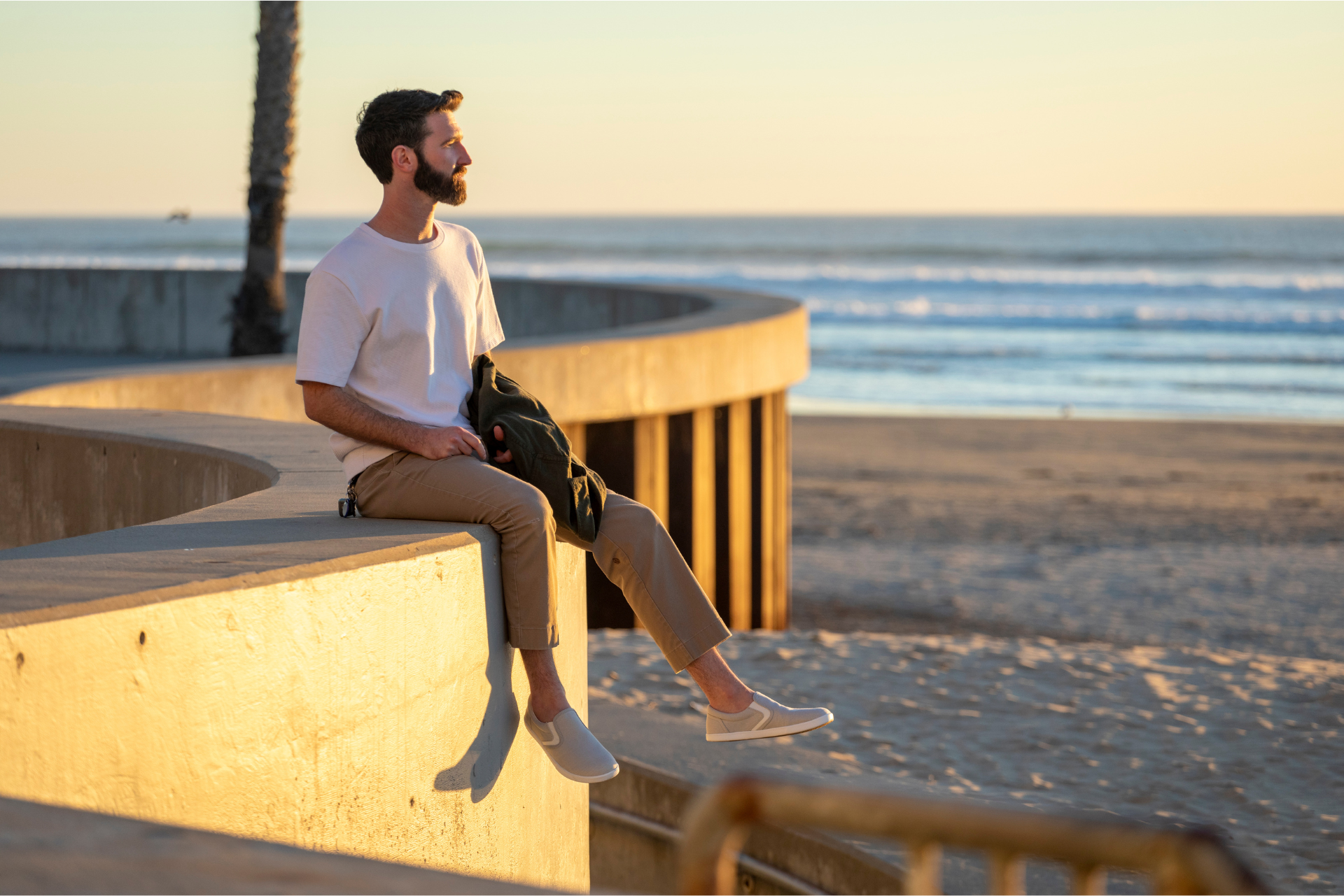 Xero Shoes Canada, specifically men’s barefoot shoes Canada, man wearing Dillon Canvas Slip Ons at a beach