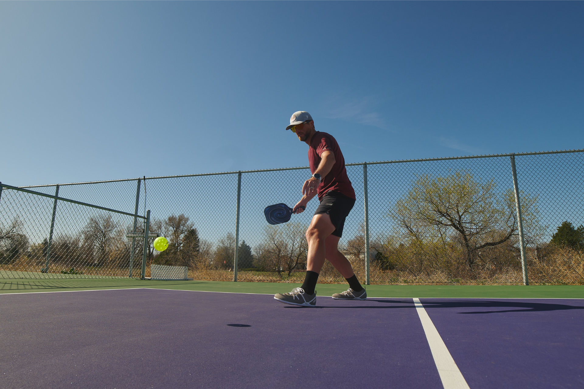 Xero Shoes Canada, specifically men’s barefoot shoes Canada. Man wearing Prio while playing pickleball. 