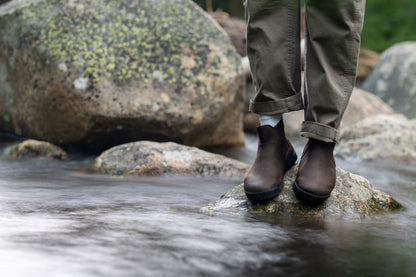 Xero Shoes Canada, specifically men’s barefoot shoes Canada. Man wearing Ridgeway Chelsea near a creek. 