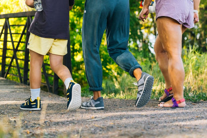 Xero Shoes Canada, specifically men’s barefoot shoes Canada. Man in middle wearing Wynn while walking with friends